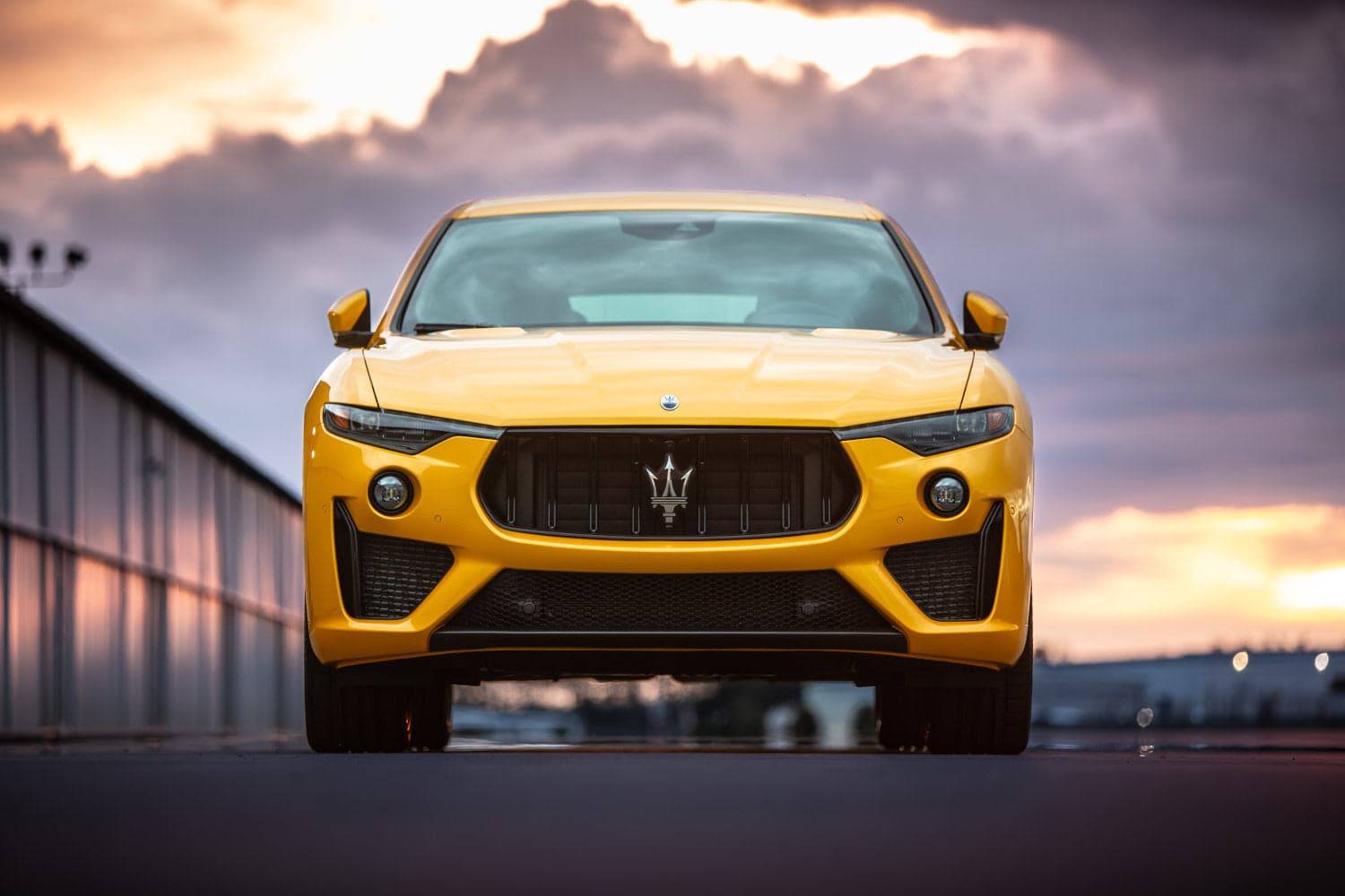 Maserati GranTurismo parked on a desert canyon road