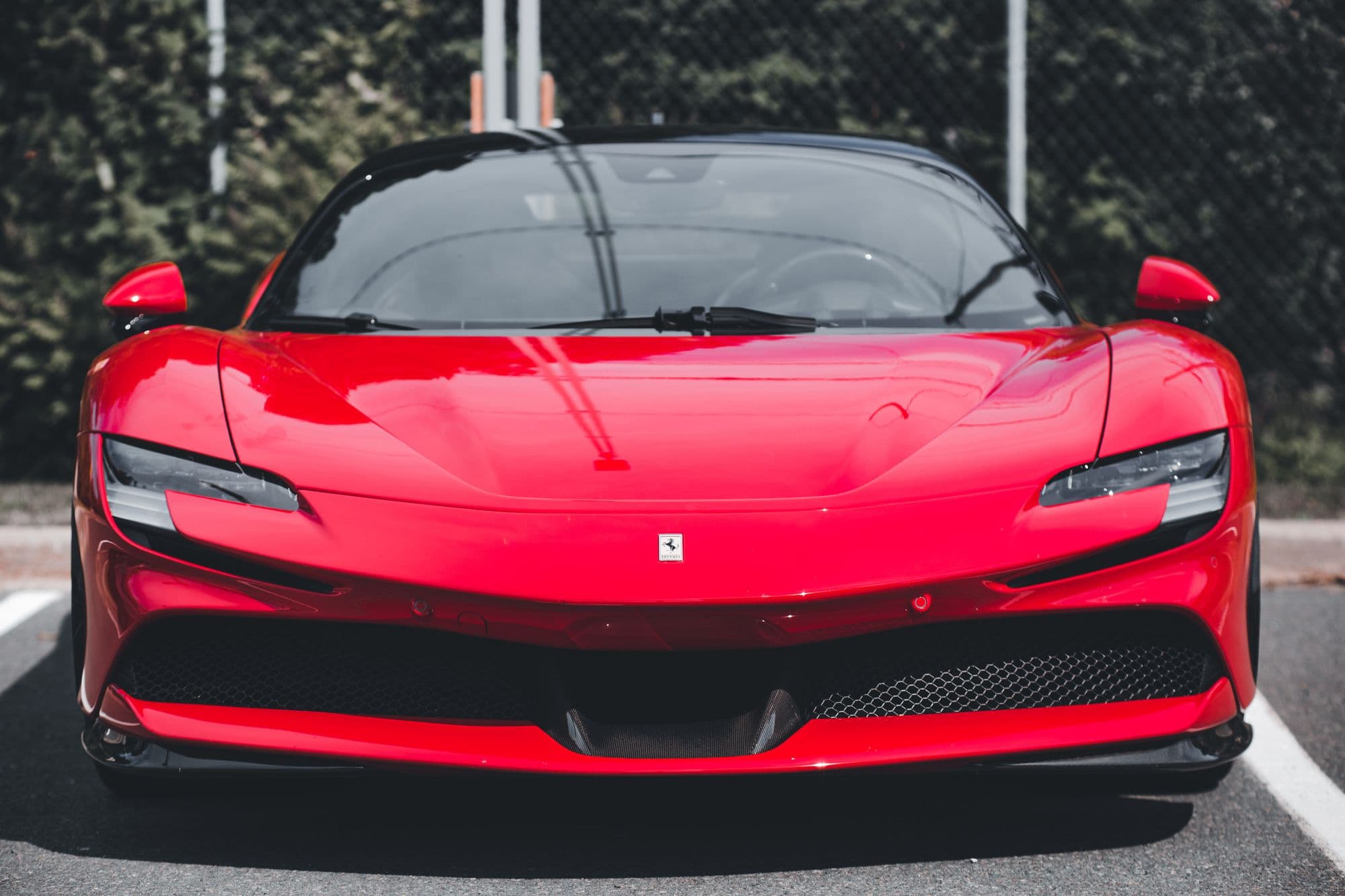 Head-on front view of a red Ferrari SF90 Stradale