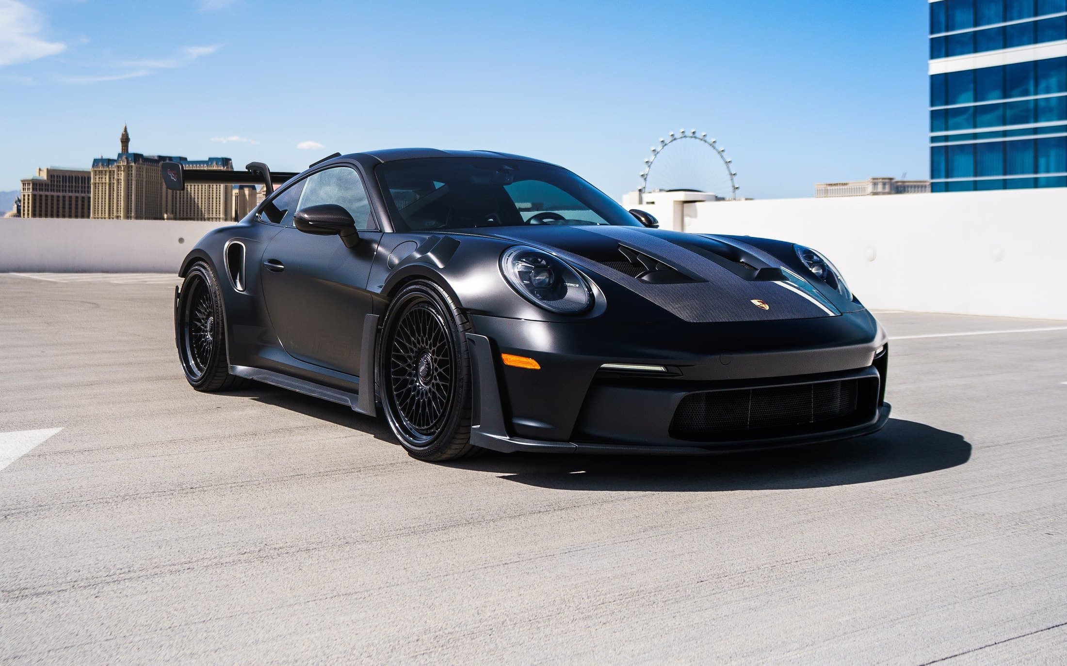 Matte black Porsche 911 on a Las Vegas rooftop