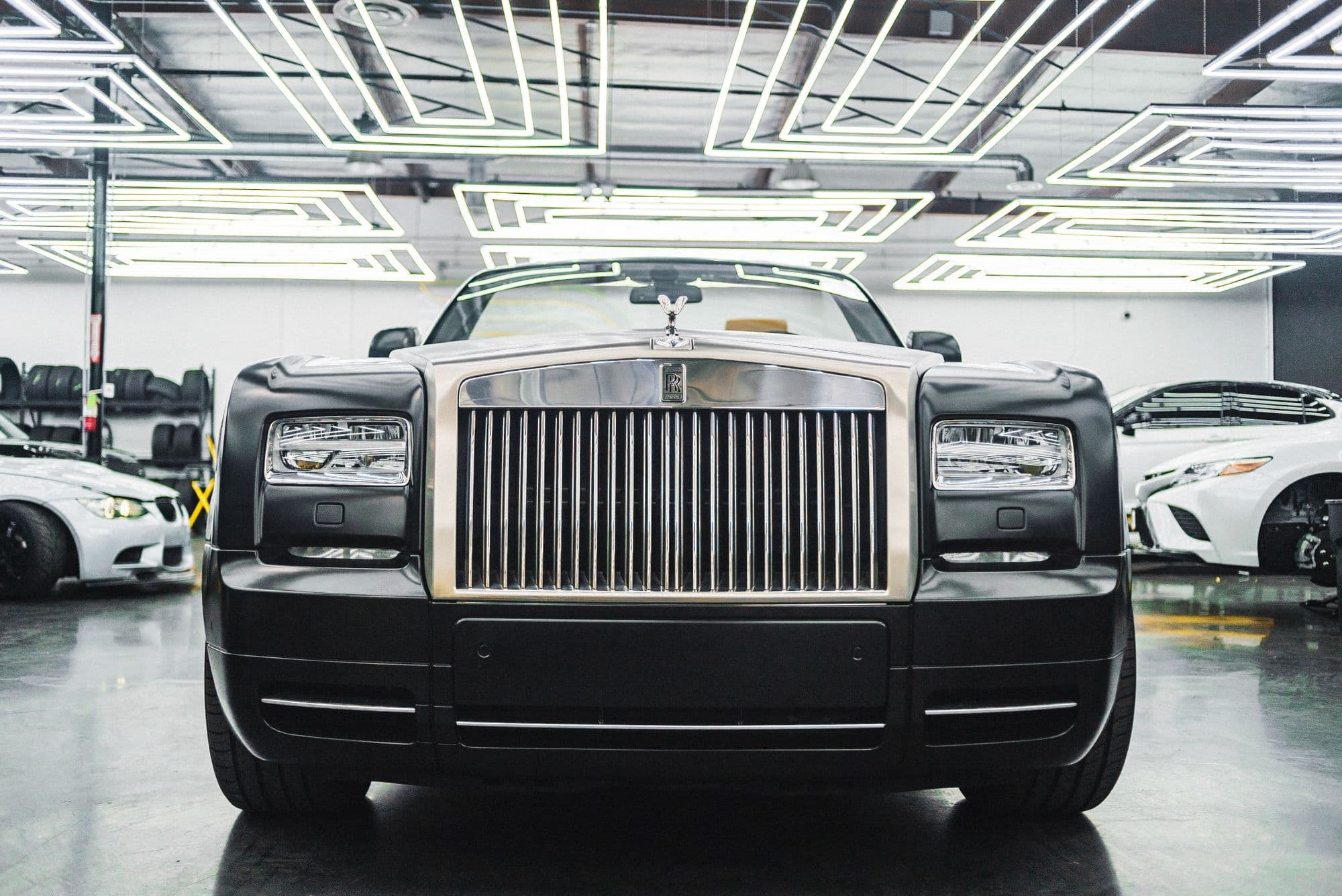 Rolls-Royce Phantom front grille inside a detailing studio