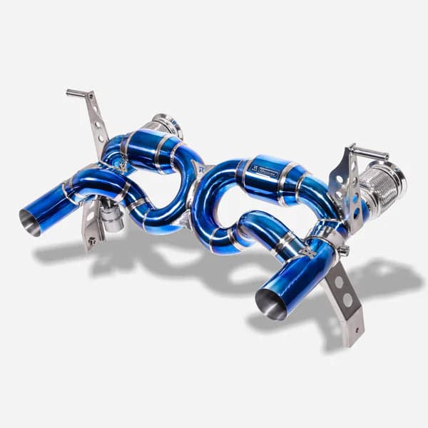 Polished performance exhaust system tips on an exotic car