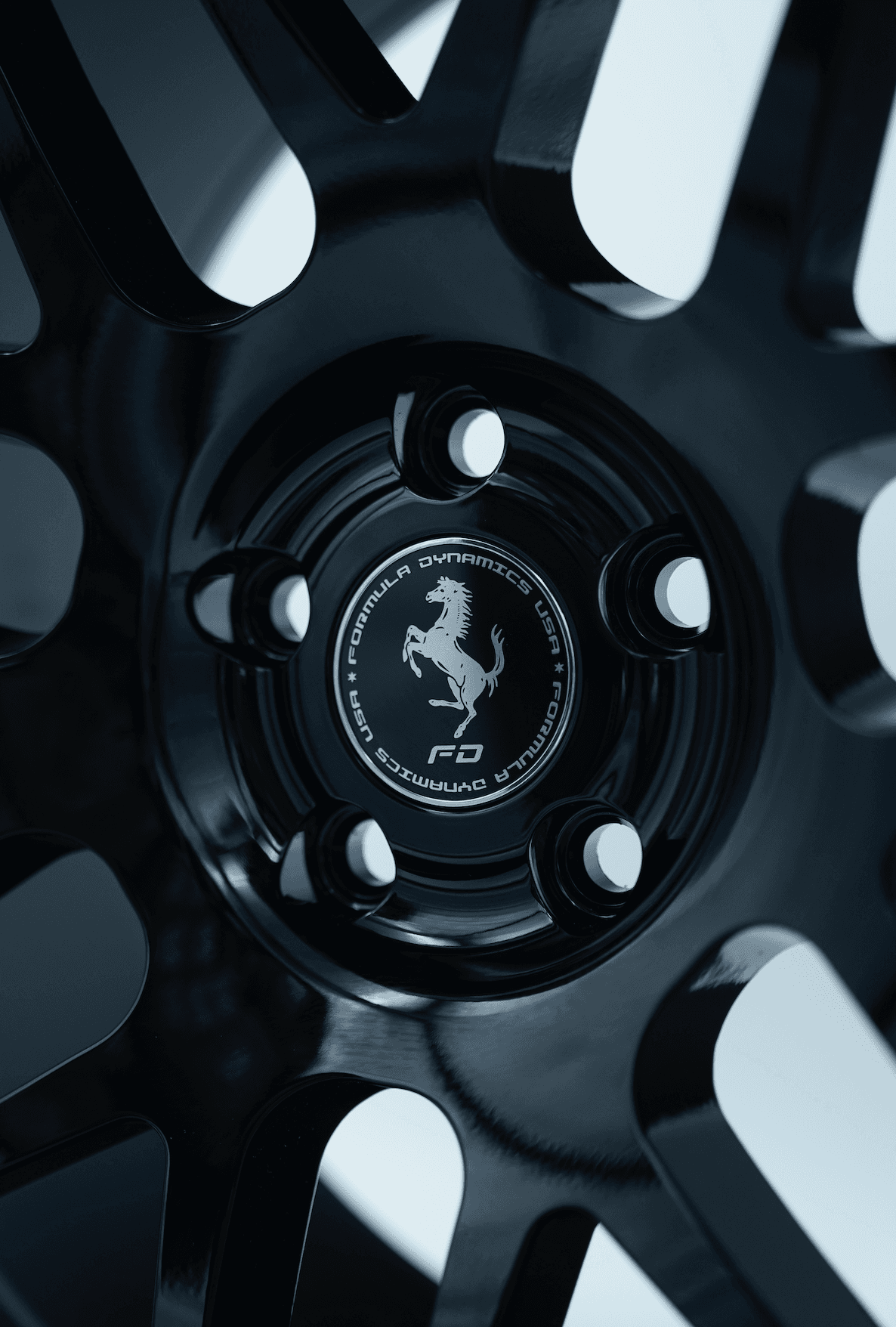 Close-up of a multi-spoke forged wheel on an exotic car